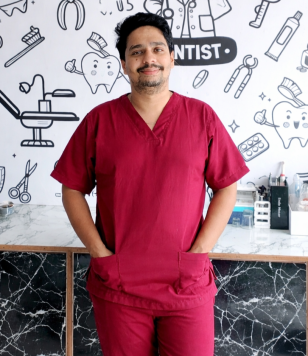 Smiling dentist in modern clinic